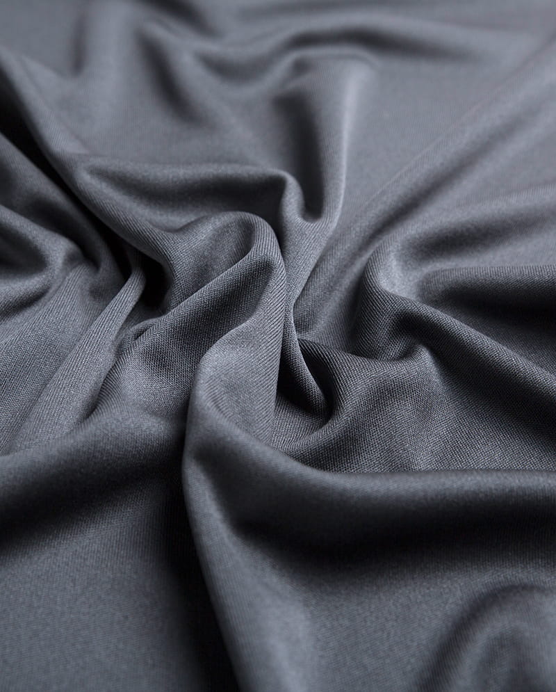 Síneadh agus leaisteachas fabraicí cniotáilte: Cén fáth a bhfuil siad oiriúnach d'iarratais spóirt agus éadaí gníomhacha?